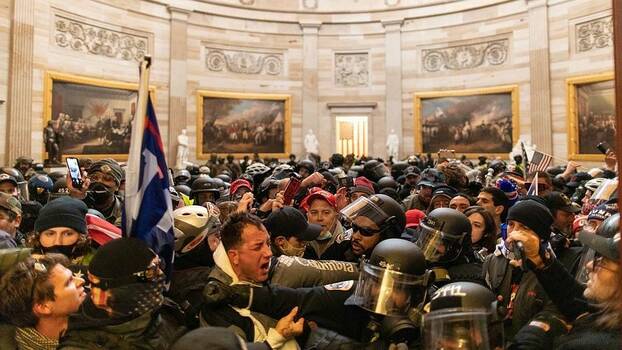 Washington D.C., January 6, 2021: Police intervenes in Trump's supporters who breached security and entered the Capitol building.