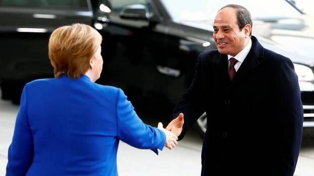 German Chancellor Angela Merkel welcomes Egyptian President Abdel Fattah al-Sisi at the Libya summit in Berlin, January 19, 2020
