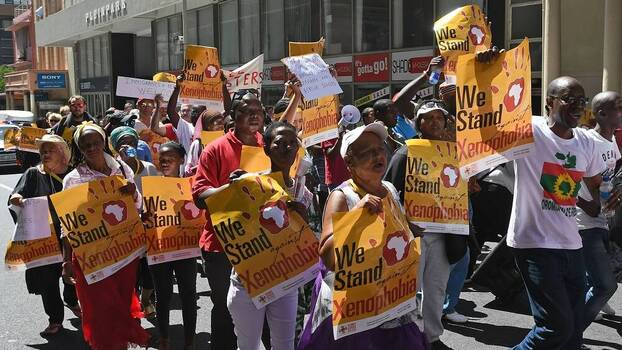 Protesters gather to march to parliament against xenophobia in Cape Town, South Africa.