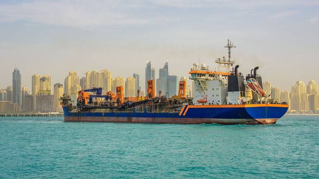 Large oil tanker ship leaving the Dubai marina port