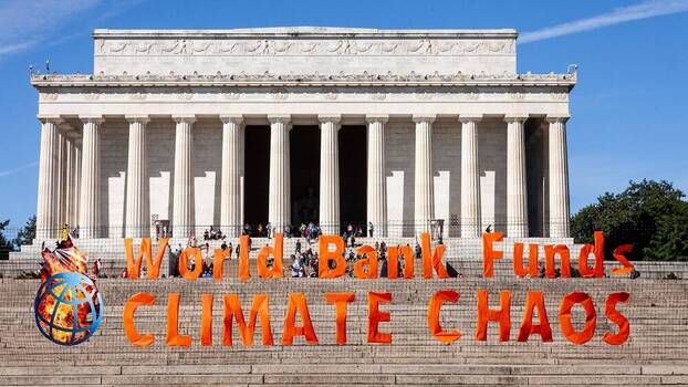Activists protest against the World Bank’s practices at the Lincoln Memorial in Washington, DC, 6 October 2022.