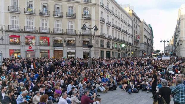 People gather during the commemoration of the fifth anniversary of the 15M Movement at La Puerta del Sol in Madrid, Spain, 15 May 2016.