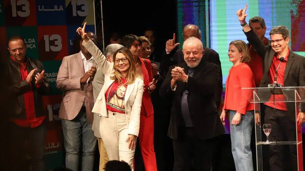 Lula and his team stand together at a press conference on election night.