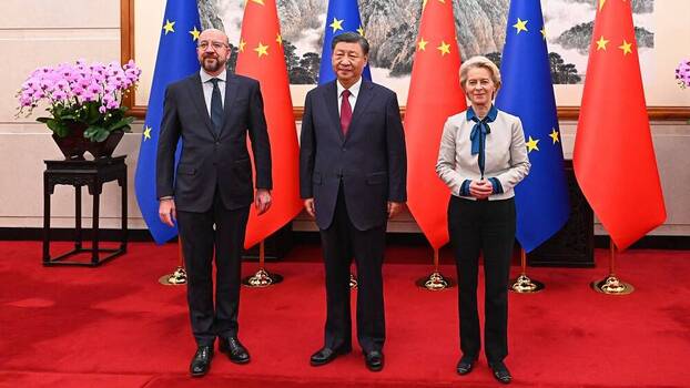 Chinese President Xi Jinping and European Commission President Ursula von der Leyen speak with European Council President Charles Michel meeting in Beijing, China.