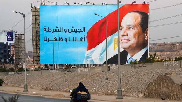 Poster with the image of President Abdel Fattah al-Sisi and the words “Military and police are on the side of the people” in Cairo, Egypt.